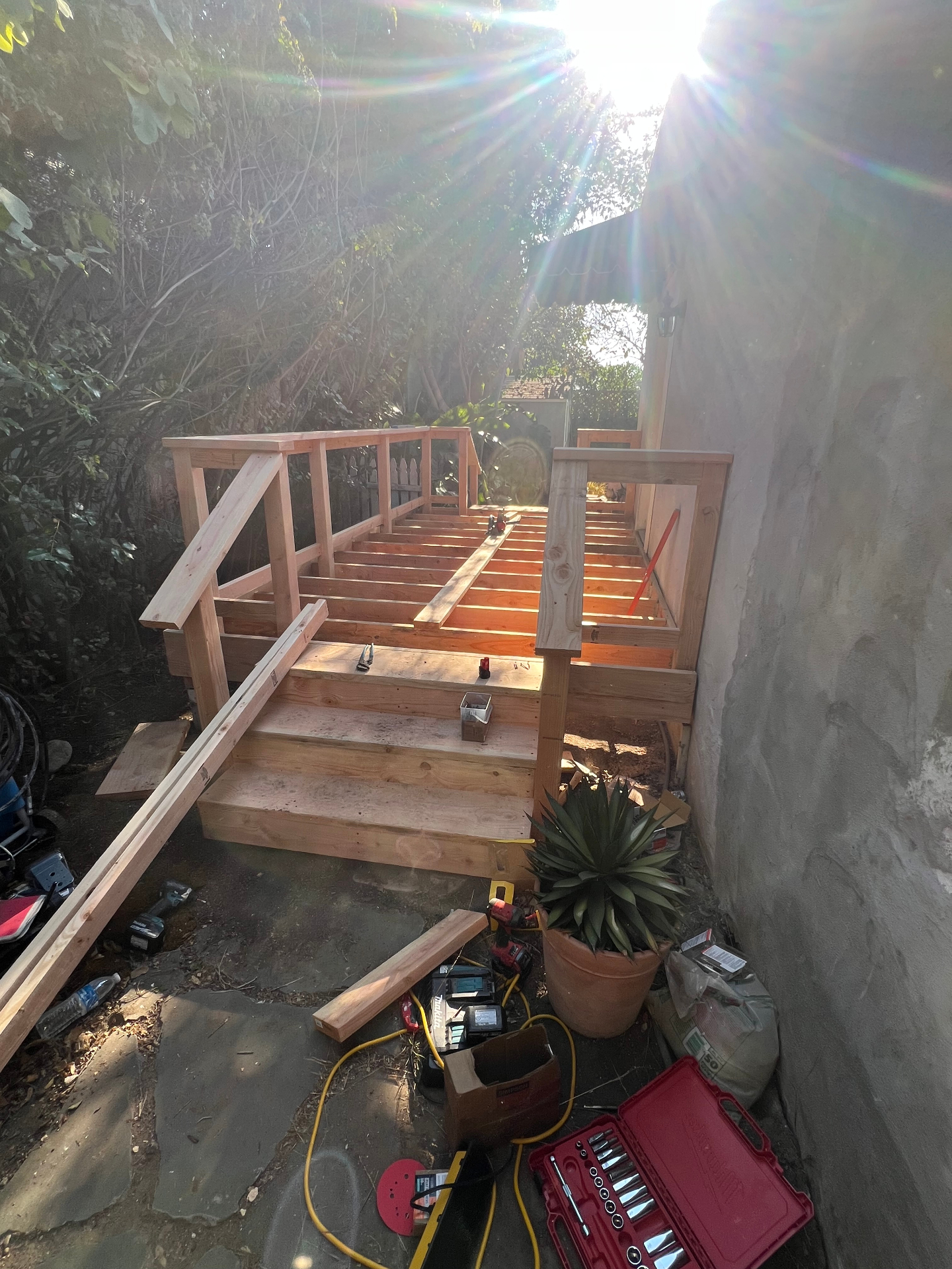 Deck framing and stair construction in progress