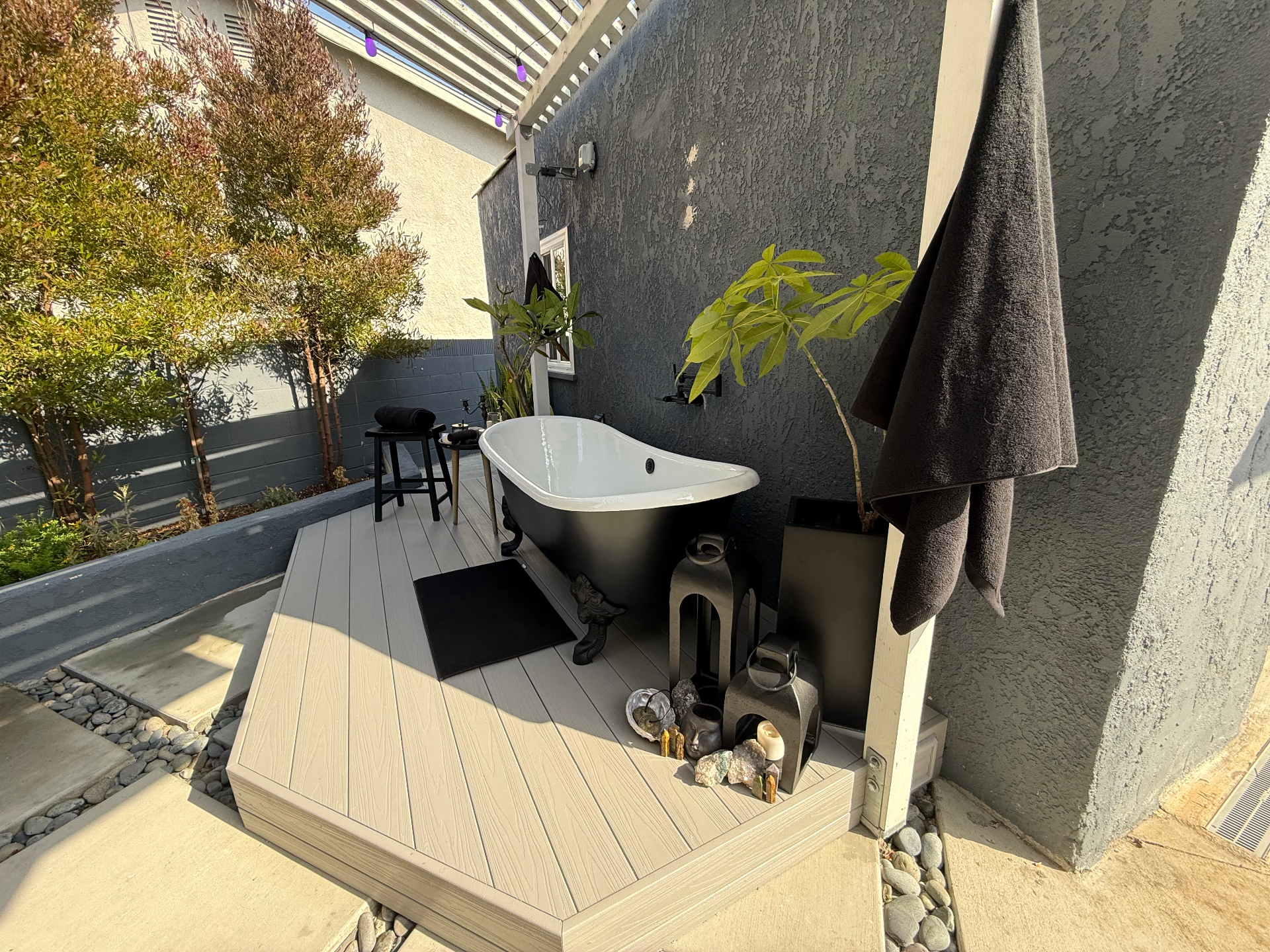 Custom outdoor space with freestanding tub built by Morgan Property Solutions